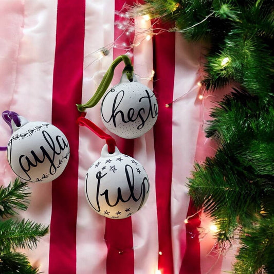 Personalised hand lettered ceramic Christmas baubles